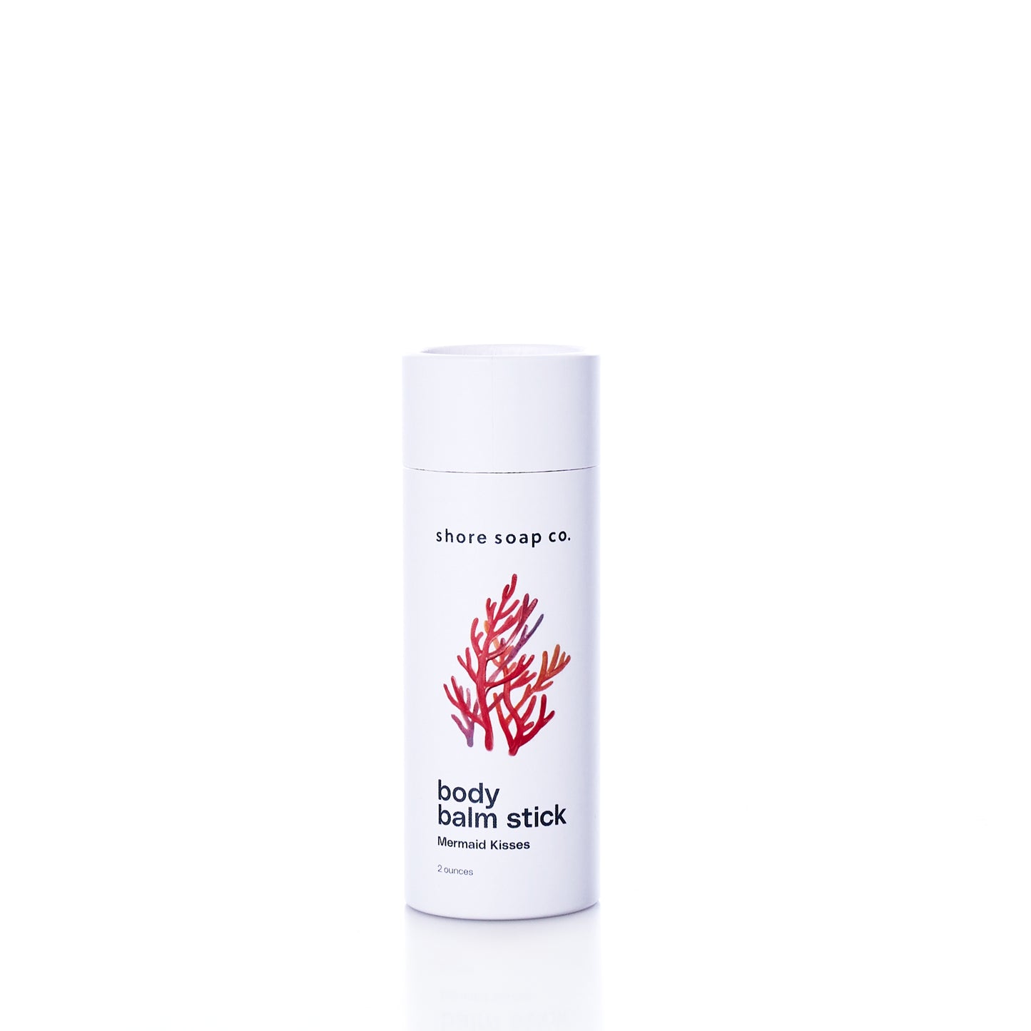 A white cylindrical container labeled Shore Soap Co. Mermaid Kisses Eco-Friendly Body Balm, adorned with a red coral graphic, is displayed against a plain white background. This natural moisturizer is part of Shore Soap Cos handcrafted personal care products collection. by Sea Bags