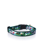 Colorful and durable, the Vacationland Dog Collar by true is an adjustable green collar adorned with Maine-themed illustrations on a white background, featuring a sturdy black plastic buckle and a metal ring.