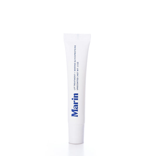 A white tube labeled Marin Skincare stands upright on a white background. The product is Marin Lip Treatment - Unscented, a hydrating lip treatment formulated with marine glycoproteins.