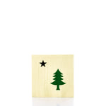 The Maine Bicentennial Cocktail Napkins by Boston International feature a yellow background with a green pine tree and a black star, inspired by the historic pine-tree-and-star flag, and are shown centered against a white backdrop. by Sea Bags