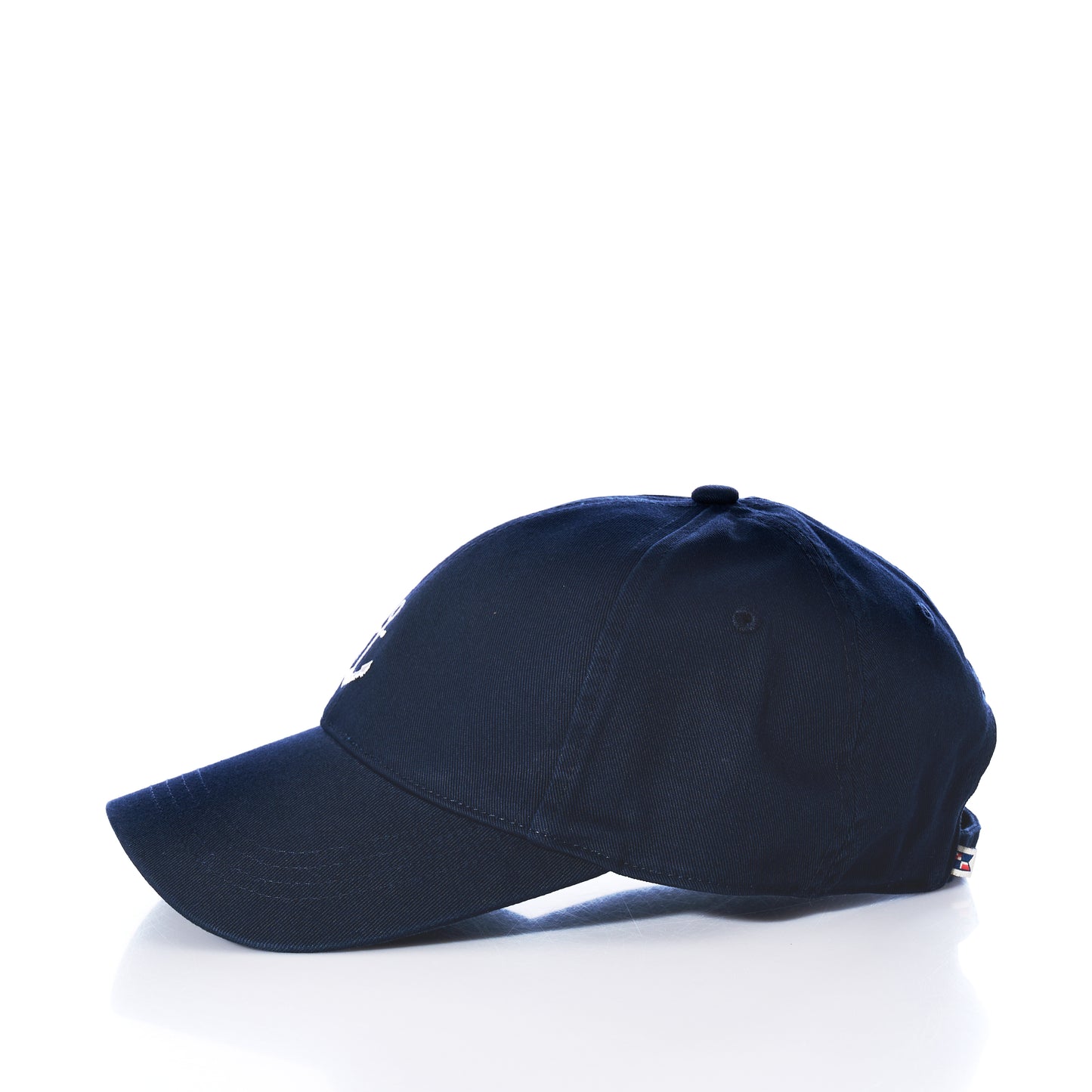 The Anchor Baseball Hat - Navy is displayed in profile against a white background, showcasing its slightly curved brim for sun protection and adjustable strap at the back.