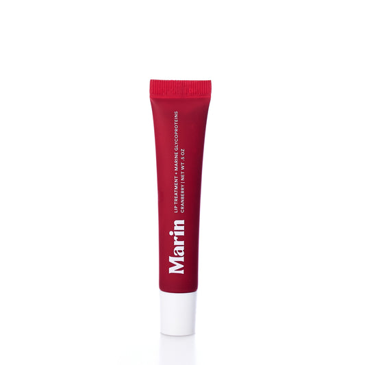 A red and white tube of Marin Skincare Marin Lip Treatment - Cranberry, enriched with Marine Glycoproteins and marine cosmo proteins, stands upright on a white background—perfect for your everyday lip care routine. by Sea Bags
