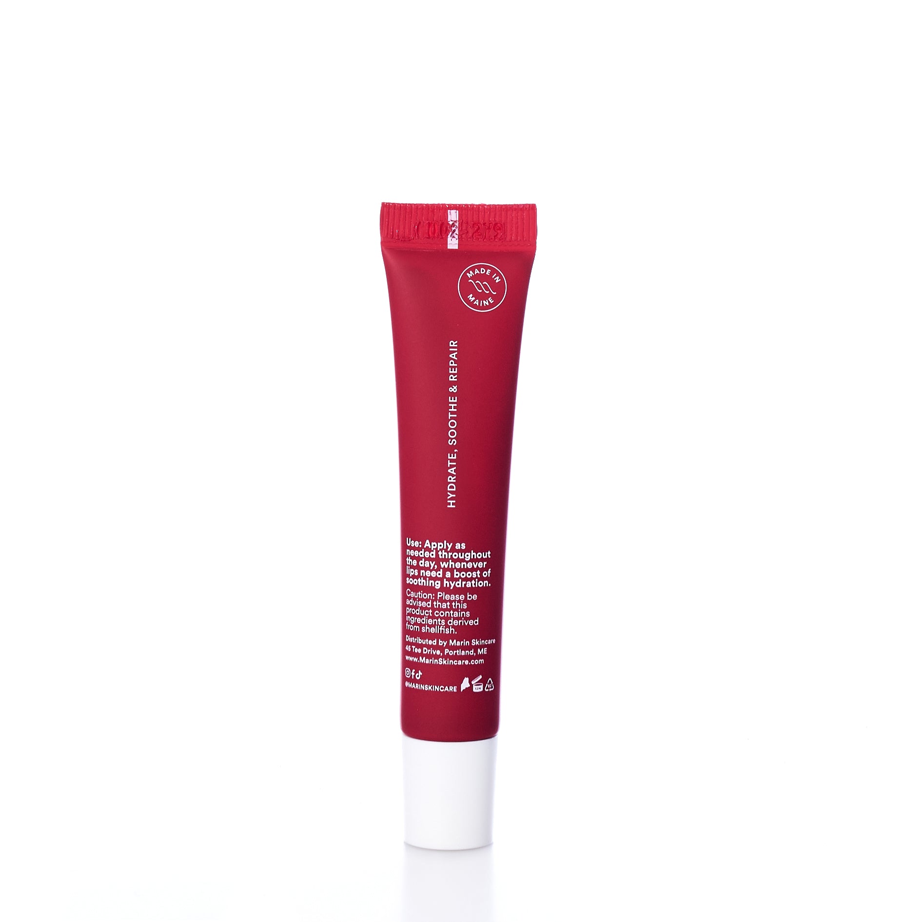 A tube of Marin Skincare Marin Lip Treatment - Cranberry stands upright on a white background, with product instructions in white text on the front and enriched with Marine Glycoproteins for effective lip care. by Sea Bags