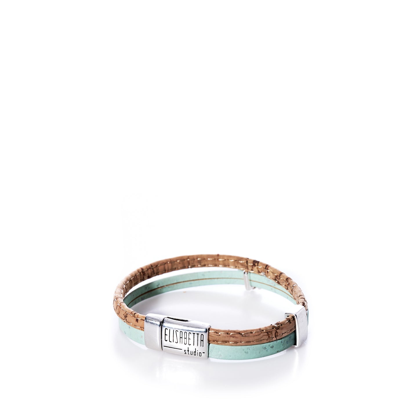A Portuguese cork bracelet in mint green with a sea turtle charm and a silver magnetic clasp engraved Elisabetta Studio, displayed on a white background. by Sea Bags