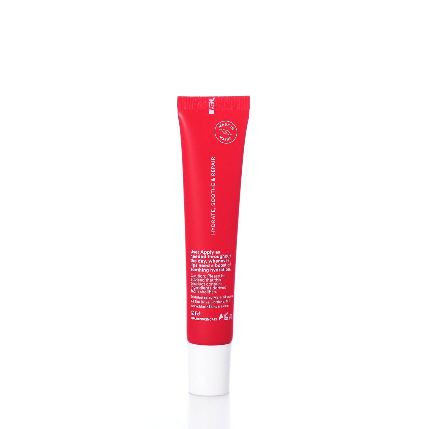 A red tube labeled Marin Lip Treatment - Strawberry Rhubarb from Marin Skincare stands upright on a white background, featuring application instructions and branding in white text. Infused with the nourishing power of strawberry rhubarb, this product provides exceptional lip hydration for lasting comfort. by Sea Bags