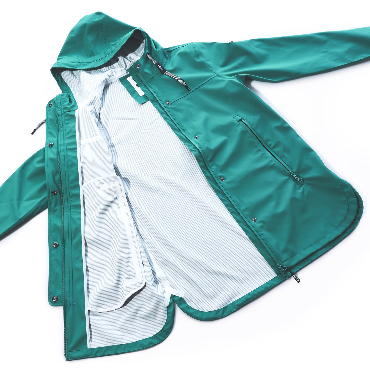 The Batela USA Inc Harborside Waterproof Raincoat in teal is shown laid flat and unzipped, revealing its white striped mesh lining. The raincoat features front zipper pockets, a drawstring hood, and a waterproof shell for dependable wet-weather protection. by Sea Bags