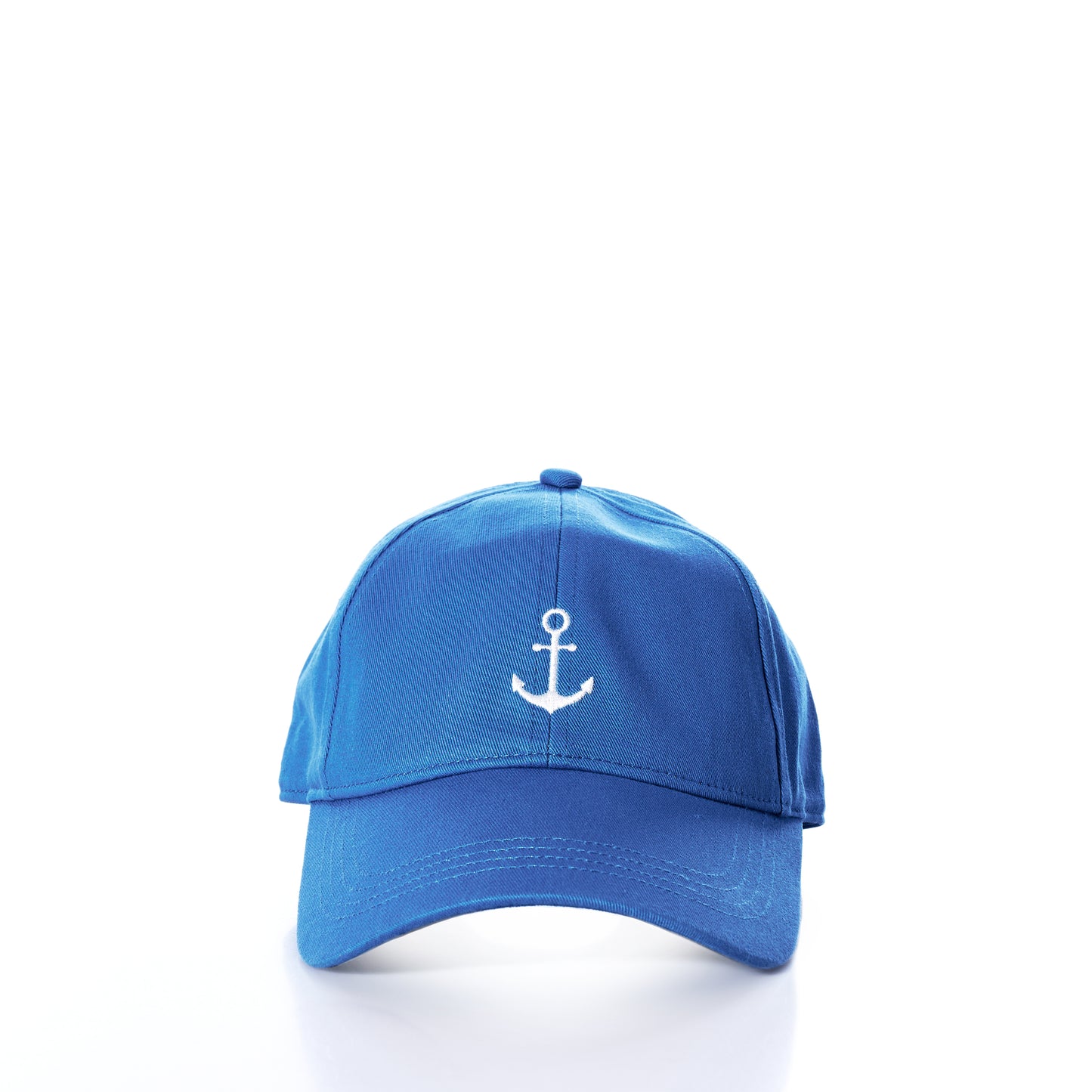 The Anchor Baseball Hat - High Tide by Batela USA Inc is a blue cap with a white embroidered anchor symbol on the front, showcased against a white background—ideal for sun protection and casual style. by Sea Bags