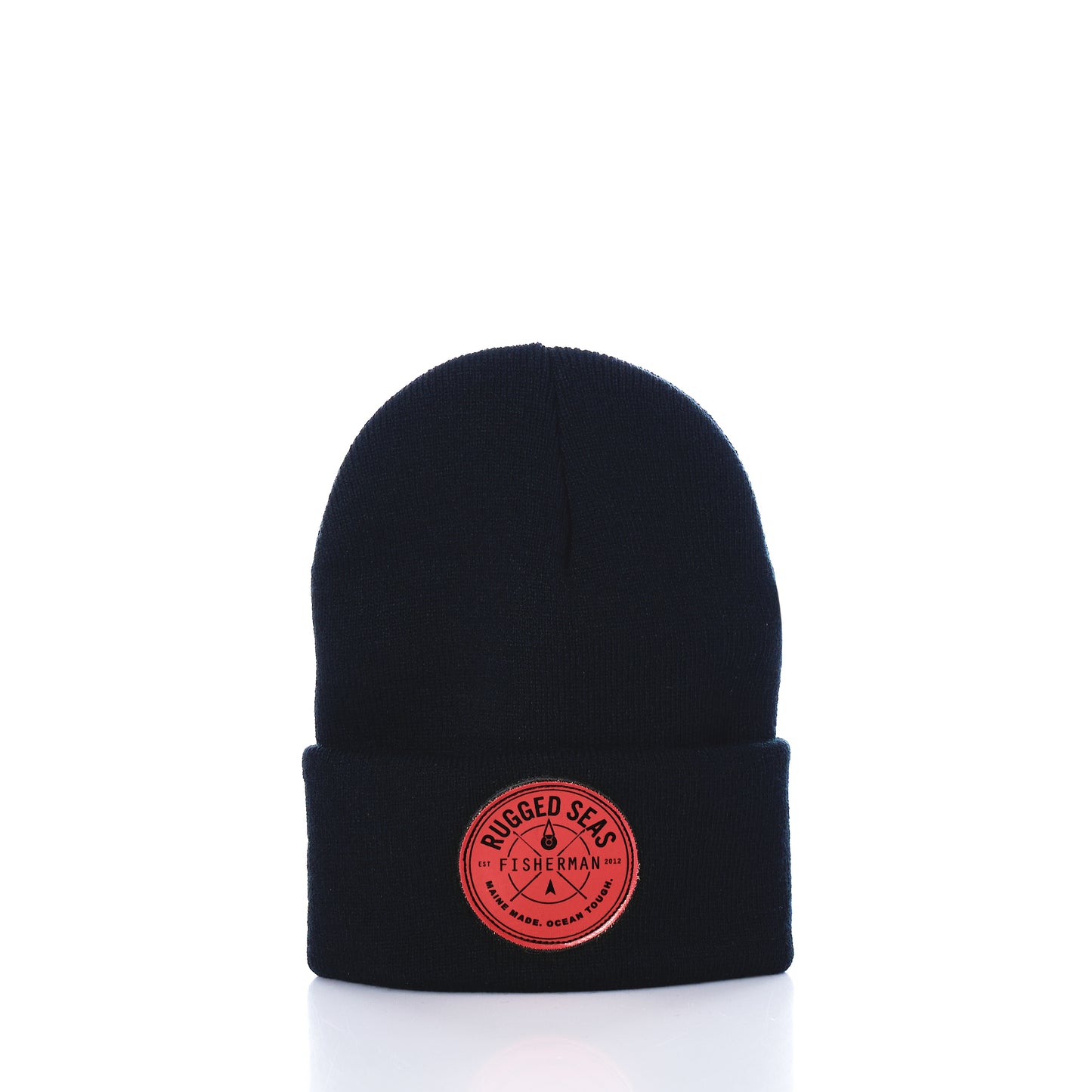 Showcased on a white background, the Rugged Seas Watch Cap by Rugged Seas is an eco-friendly black beanie crafted from recycled bib material. It features a folded brim and a circular red patch on the front that reads Rugged Seas Fisherman, making it a standout nautical statement piece. by Sea Bags