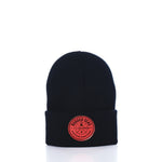 Showcased on a white background, the Rugged Seas Watch Cap by Rugged Seas is an eco-friendly black beanie crafted from recycled bib material. It features a folded brim and a circular red patch on the front that reads Rugged Seas Fisherman, making it a standout nautical statement piece. by Sea Bags