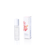 A clear roll-on fragrance bottle labeled Mermaid Kisses Eco-Friendly Roll-On Fragrance by Shore Soap Co. stands beside its white box adorned with coral illustrations on a white background, capturing the fresh and alluring essence characteristic of this beloved scent. by Sea Bags