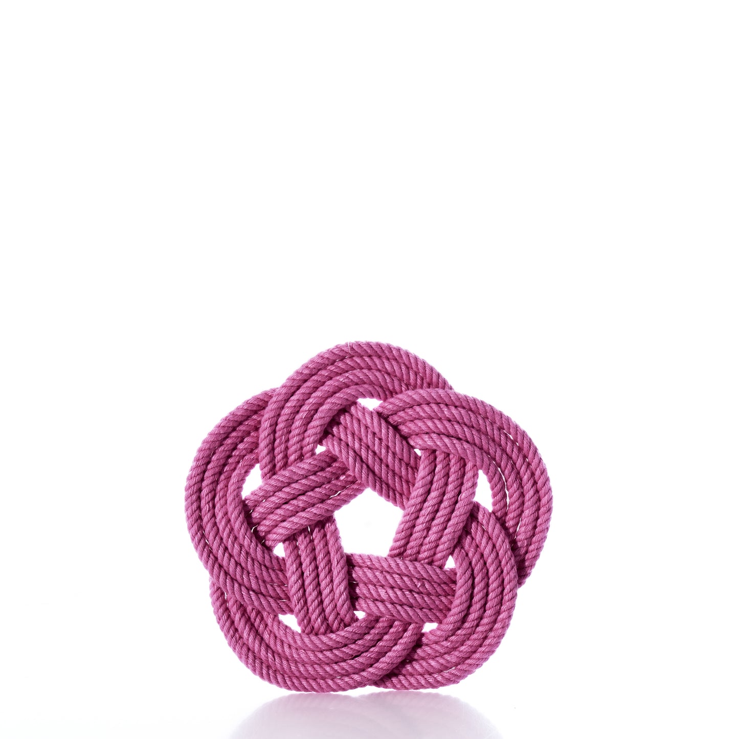 A Nautical Sailor Knot Coaster Set of 4 - Pink by true is arranged in a decorative, symmetrical knot with a circular pattern and displayed against a white background. by Sea Bags