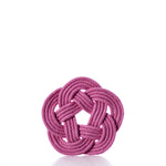 A Nautical Sailor Knot Coaster Set of 4 - Pink by true is arranged in a decorative, symmetrical knot with a circular pattern and displayed against a white background. by Sea Bags