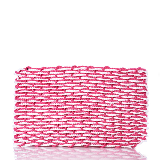 The Fisherman Rope Mat - Pink  White from Advanced Industrial Solutions Inc is an eco-friendly woven mat crafted from pink and white yarn, shown against a white background. by Sea Bags
