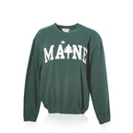 The Crewneck Pullover - Willow Maine Tree by Soft As A Grape features MAINE printed in bold white letters across the front, accented by a pine tree and star design. This classic crewneck sweater offers a cozy camp style—perfect for anyone wanting to show their love for the outdoors. by Sea Bags