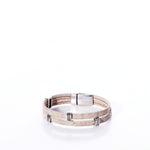 Classic Cork Bracelet - Stripe Bands on White by Elisabetta Studio, featuring a tan double-wrap eco-friendly cork leather band with silver clasp and silver accent rings, handcrafted in Vermont and displayed on a white background. by Sea Bags