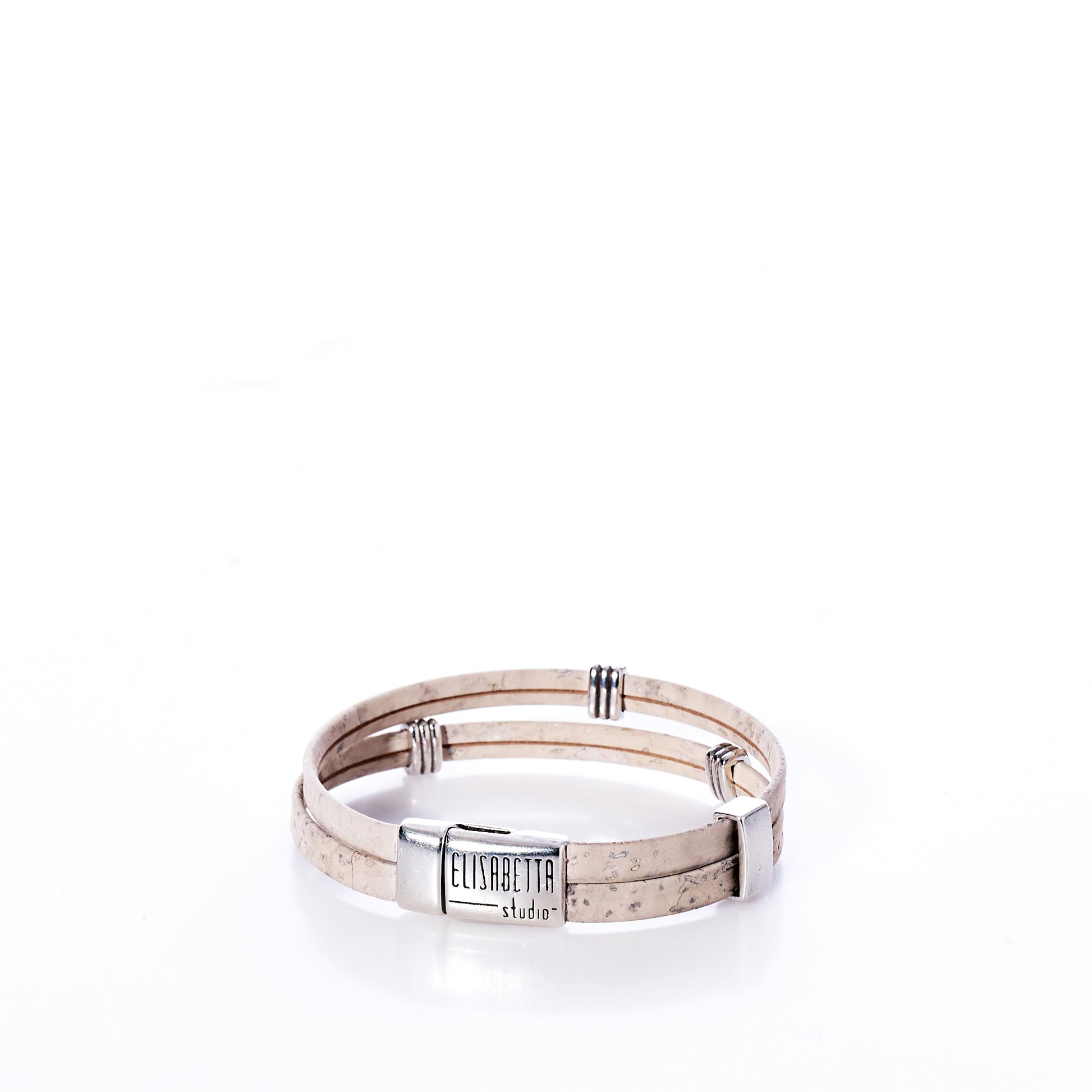 Classic Cork Bracelet - Stripe Bands on White by Elisabetta Studio, featuring double beige cork bands and a silver clasp engraved with the brand name, handcrafted in Vermont and displayed on a white background. by Sea Bags