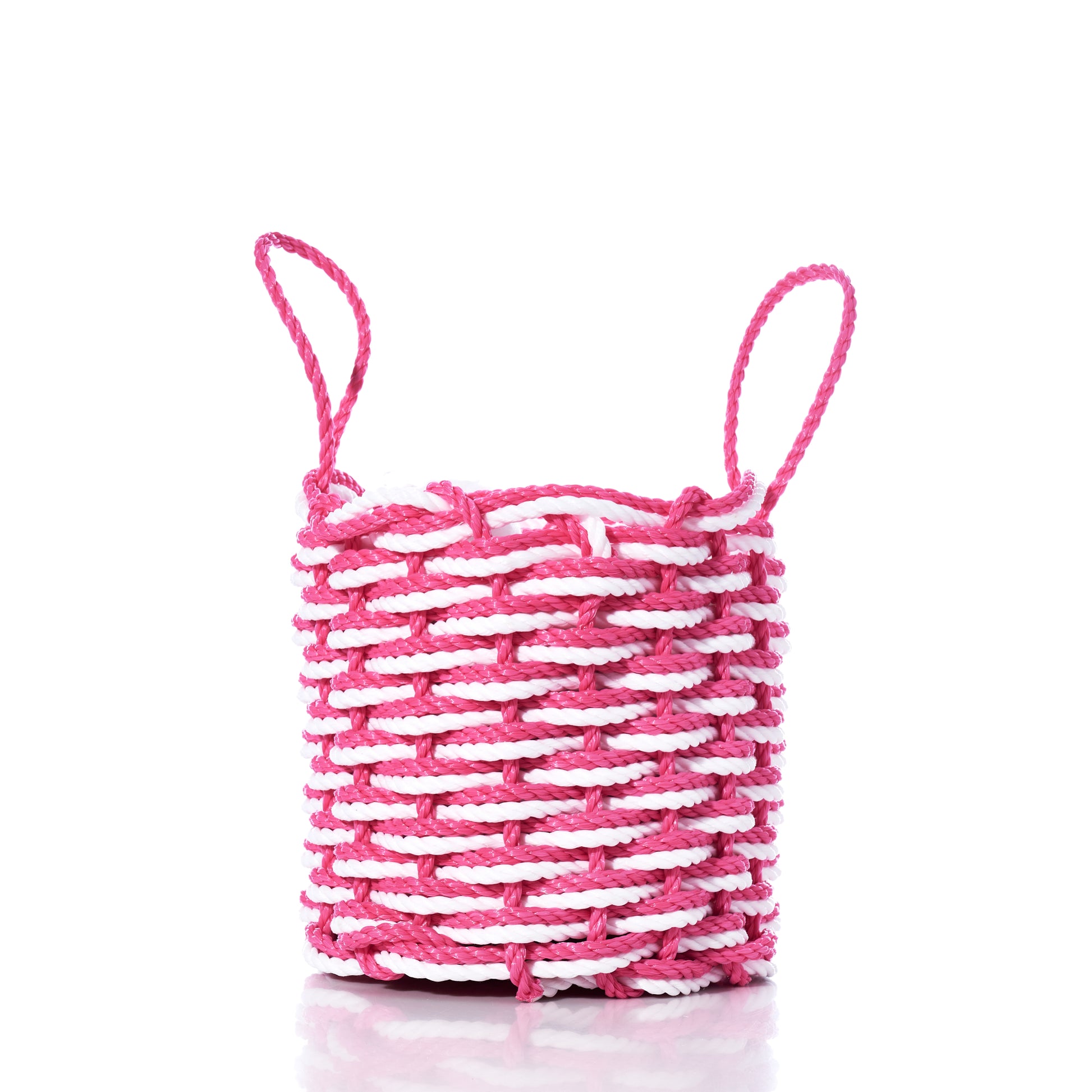 The Fisherman Rope Basket - Pink  White by Advanced Industrial Solutions Inc features two looped handles and is handwoven in Maine from eco-friendly materials, shown here on a white background. by Sea Bags