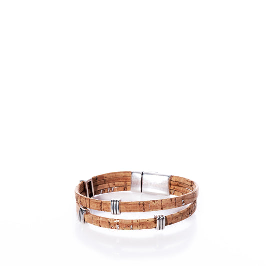The Classic Cork Bracelet - Stripe Bands on Natural by Elisabetta Studio features double-layered, eco-friendly Portuguese cork leather with silver metal accents and a secure clasp, all beautifully showcased on a white background. by Sea Bags