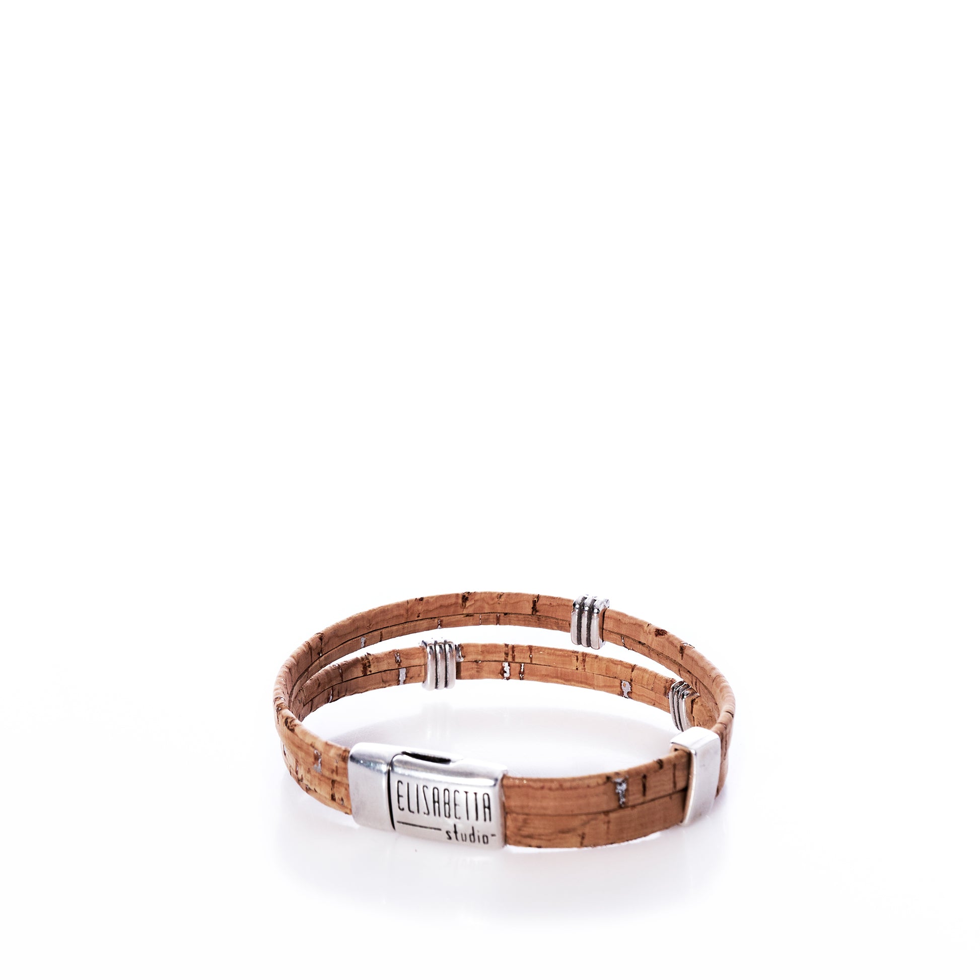 Handcrafted from eco-friendly cork leather, the Classic Cork Bracelet - Stripe Bands on Natural by Elisabetta Studio features a double-wrap design with silver-tone clasps and a central rectangular plate engraved with the brand’s name, shown against a white background. by Sea Bags