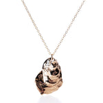 Pendant Necklace - Large Oyster Bronze by Maine Yoga Jewelry features a polished, sculptural oyster shell pendant on a gold chain, elegantly displayed against a white background—an ideal statement piece of coastal jewelry for those seeking a bold look. by Sea Bags