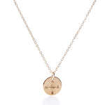 Discover the Pendant Necklace - Gold Compass Rose by Maine Yoga Jewelry, a gold chain necklace featuring a round pendant engraved with an intricate compass rose design and the letters N, E, S, and W. Thoughtfully made in Maine, this elegant nautical accessory is perfect for those drawn to adventure and timeless style. by Sea Bags