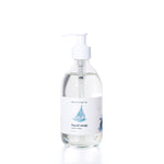 Smooth Sailing Eco-Friendly Liquid Soap by Shore Soap Co comes in a pump bottle featuring an illustration of a sailboat on the label. This gentle, pH-balanced formula is kind to skin, making it perfect for everyday use. by Sea Bags