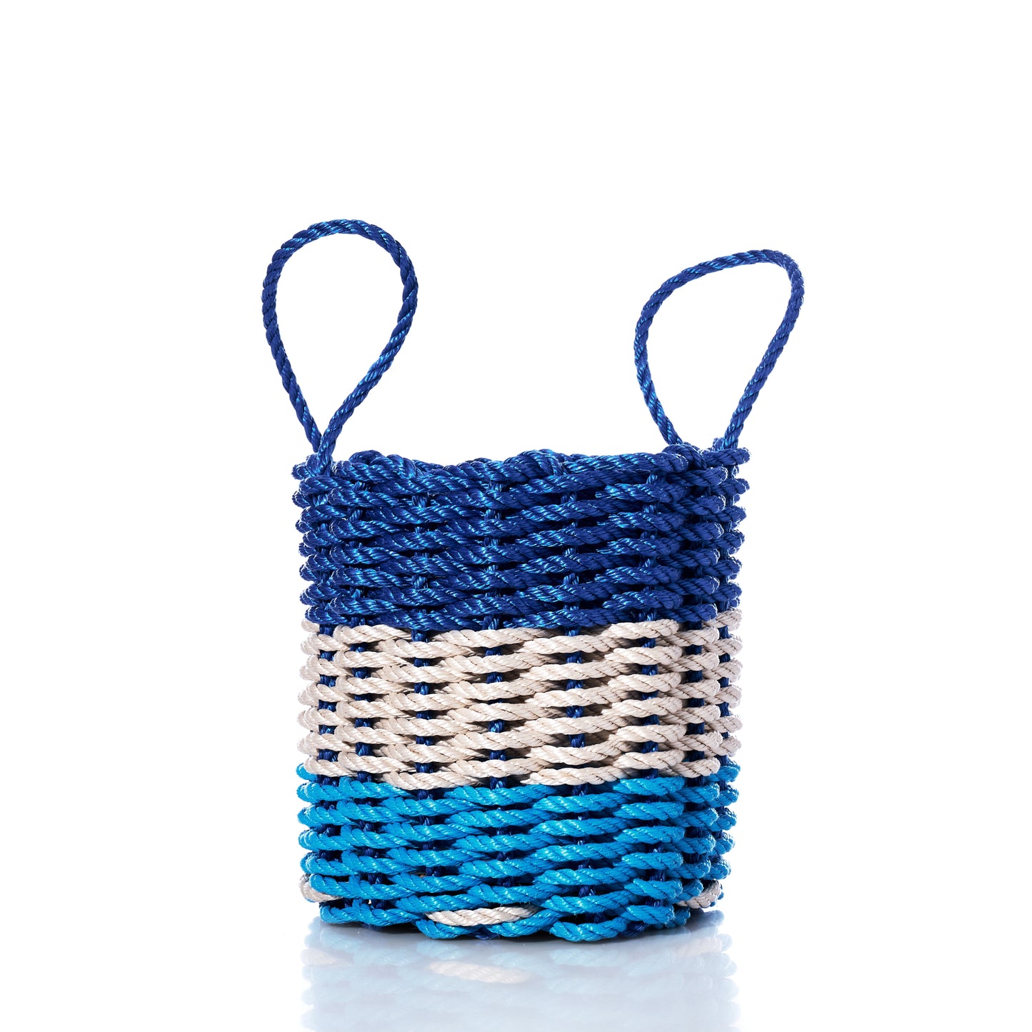 A small, eco-friendly Fisherman Rope Basket by Advanced Industrial Solutions Inc, featuring two handles and horizontal bands in blue, light blue, and tan—crafted with classic Maine-inspired techniques and set against a white background. by Sea Bags