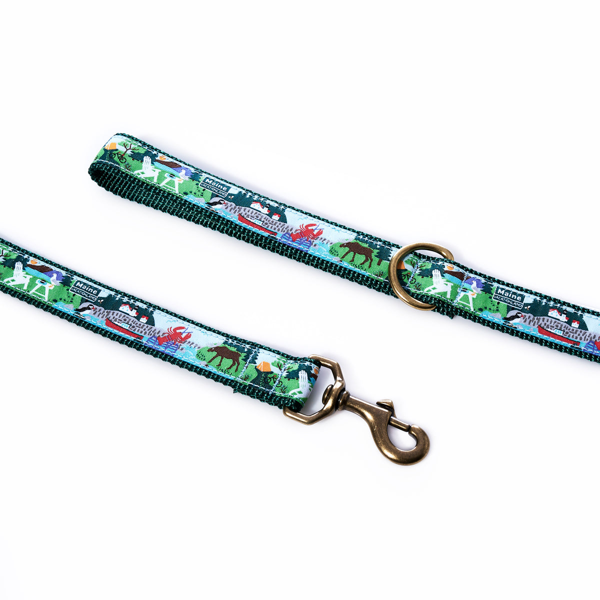 The Belted Cow Vacationland Dog Leash, featuring a colorful animal and nature print with playful lobsters, comes with a sturdy brass clip and ring and is displayed on a white background.
