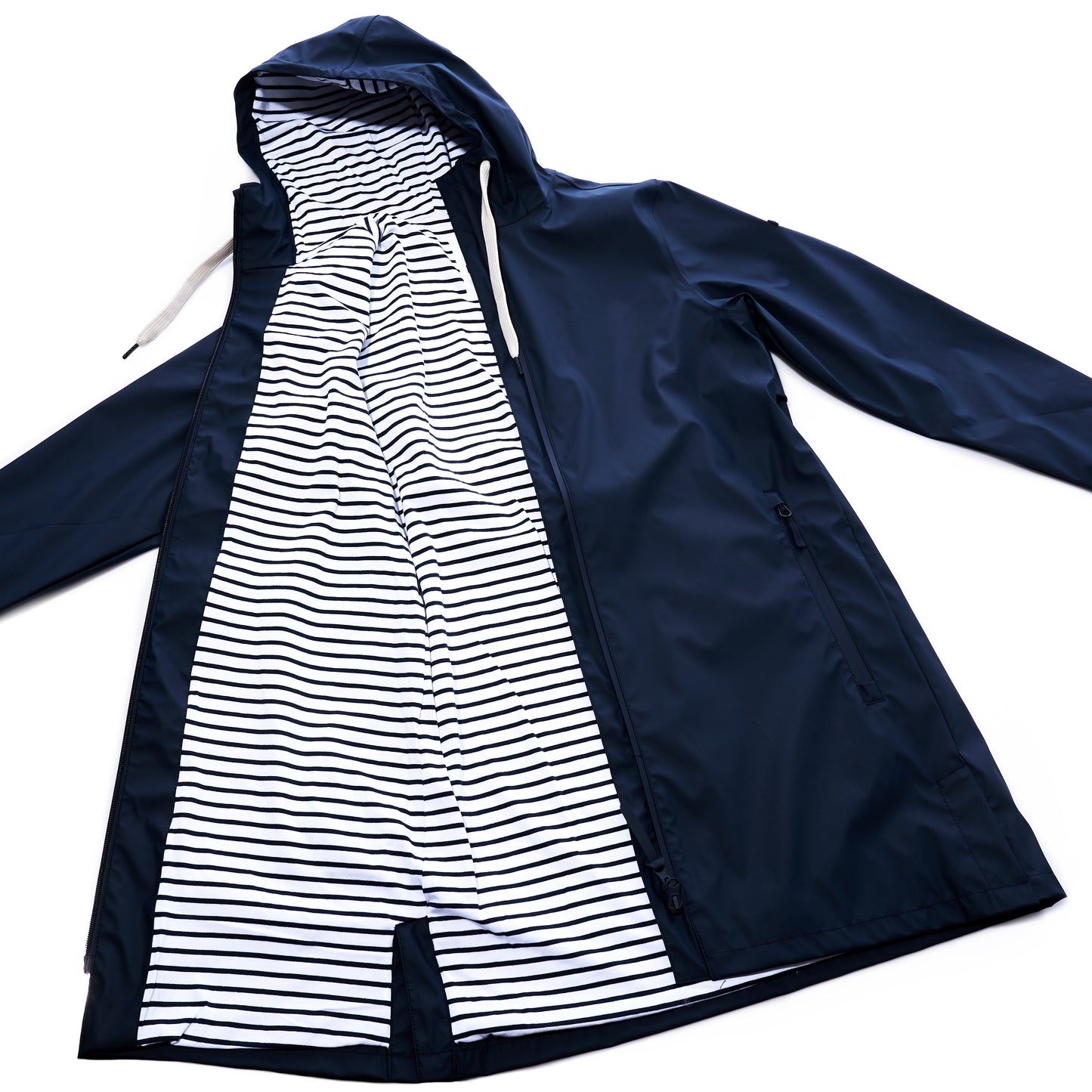 The Harborside Waterproof Raincoat - Navy by Batela USA Inc is shown open, displaying a white lining with black horizontal stripes. This unisex raincoat offers a waterproof shell for dependable protection during rainy days. by Sea Bags