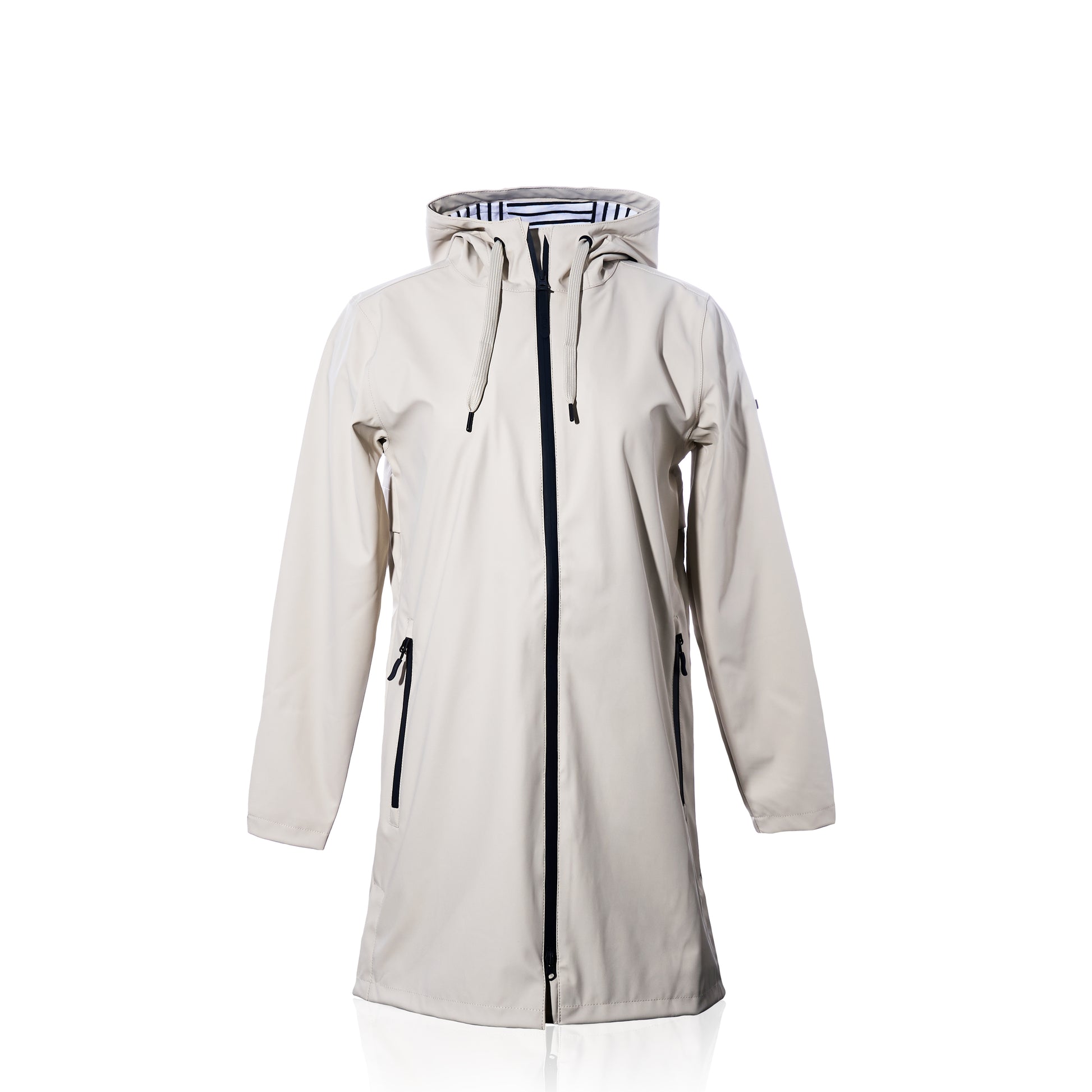 Harborside Waterproof Raincoat - Moonstruck by true: This long beige unisex raincoat features a hood, black zipper, and convenient side pockets, showcased against a white background. Its waterproof shell offers reliable protection from the elements, while the interior is lined with a chic black and white striped pattern.