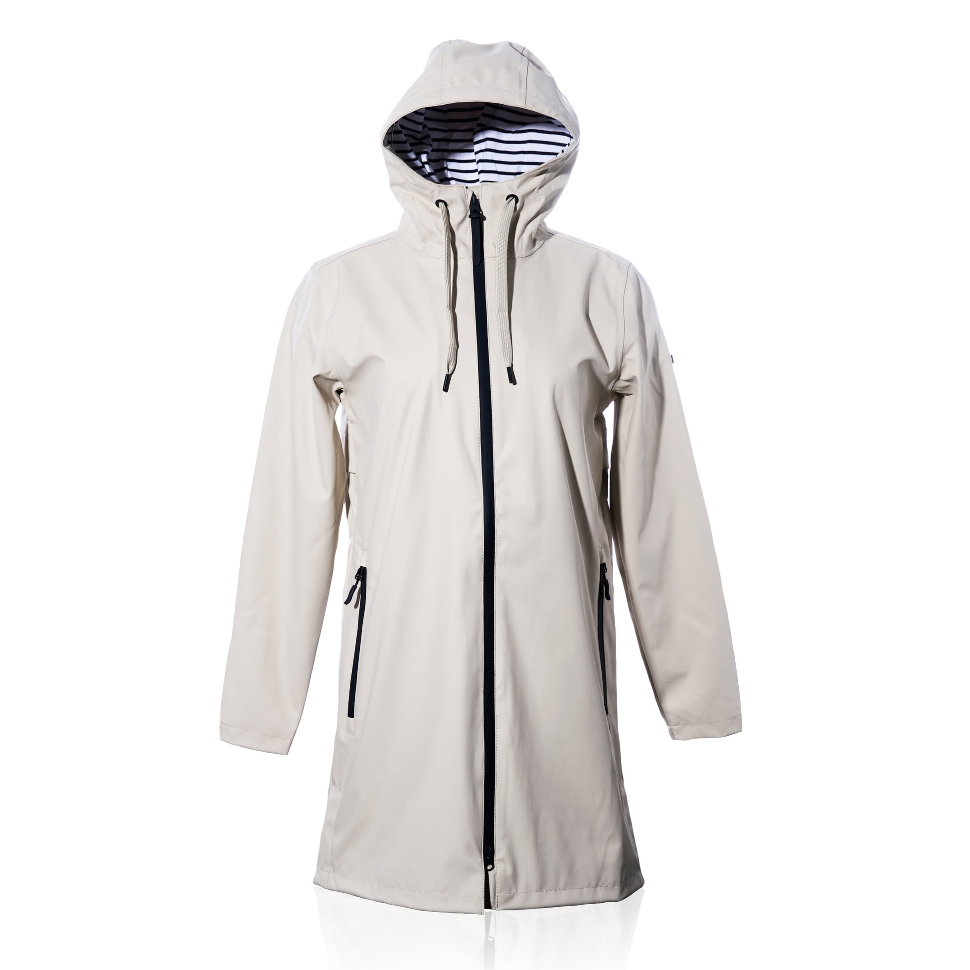 Harborside Waterproof Raincoat - Moonstruck by true: a long, unisex hooded raincoat in light beige with a waterproof shell, black zipper and pocket zippers, and a striped black-and-white inner lining, shown against a white background.
