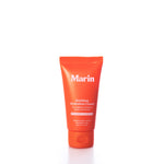 A small orange tube labeled Marin Skincare Mini Soothing Hydration Cream stands upright on a white background. Powered by Marine Glycoproteins, this cream is expertly formulated by Marin Skincare to deliver deep repair and hydration for sensitive, eczema-prone skin. by Sea Bags