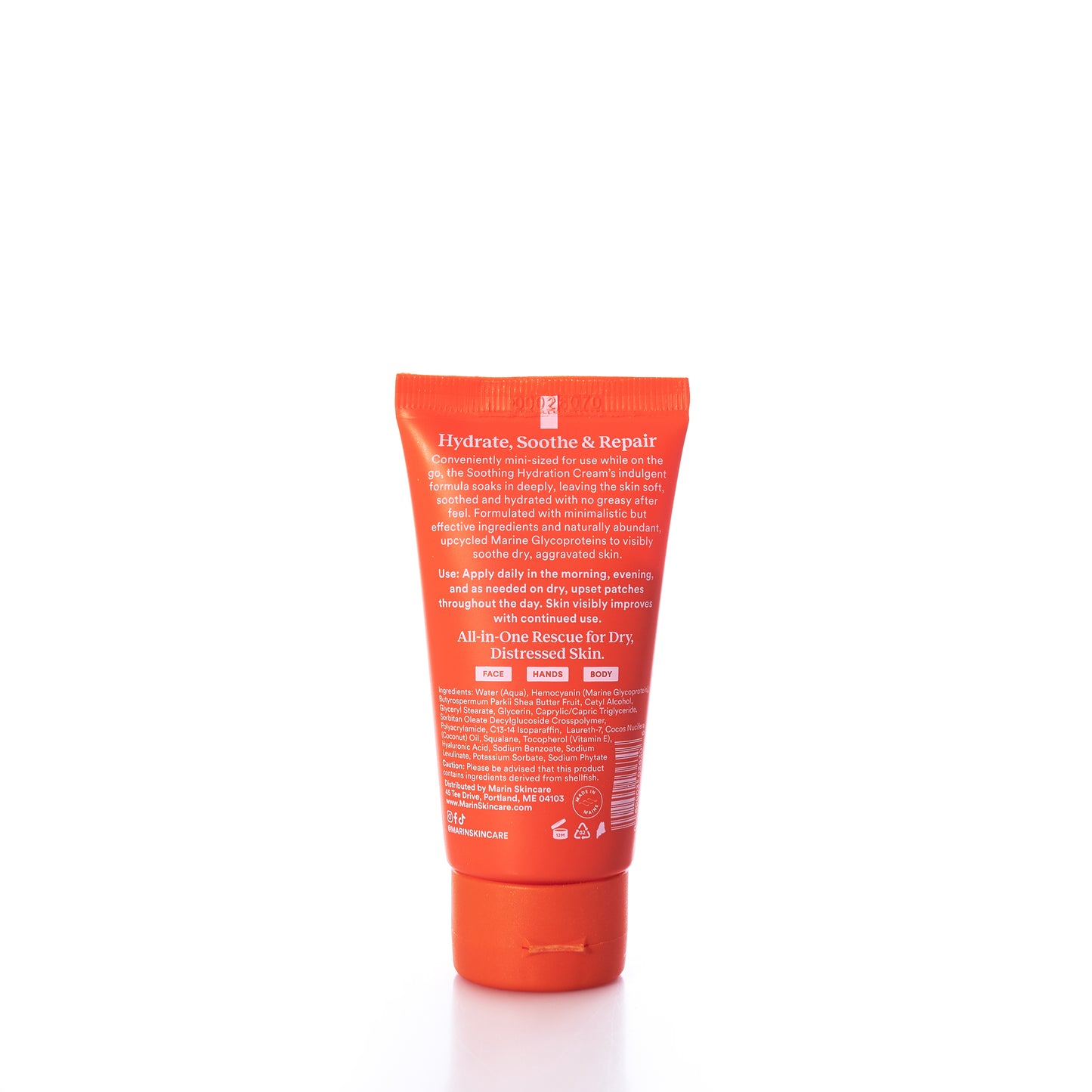 A small orange tube labeled Marin Skincare Mini Soothing Hydration Cream features white text detailing usage instructions and benefits for dry, distressed skin. This hydration cream from Marin Skincare is enriched with Marine Glycoproteins for advanced skin repair and stands upright on a white background. by Sea Bags