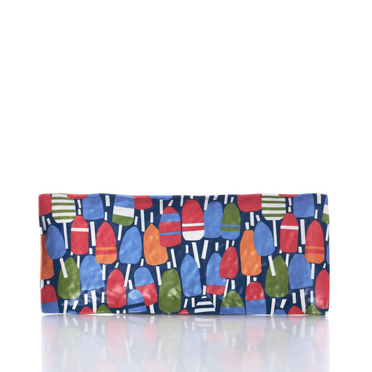 The Merritt Designs Nautical Buoys Appetizer Tray by Merritt International Inc features a rectangular ceramic shape adorned with a vibrant pattern of red, blue, green, and orange nautical buoys set against a dark blue background. Perfect for serving at your lake house or coastal gatherings, this stylish serveware piece is shown displayed on a reflective white surface. by Sea Bags