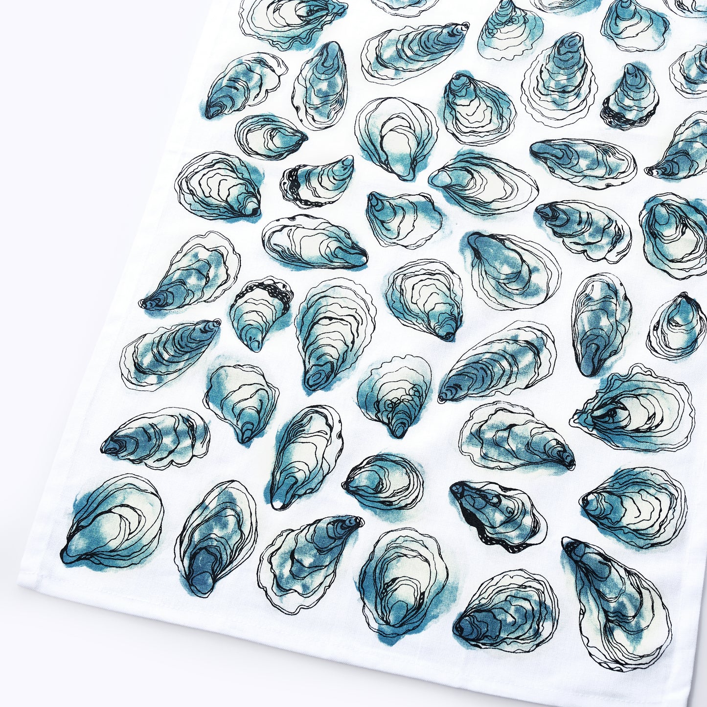 The Oysters Print Tea Towel by true is made from 100 white cotton and showcases a repeated pattern of blue and black oyster shell illustrations—perfect for adding a touch of coastal charm to your kitchen.