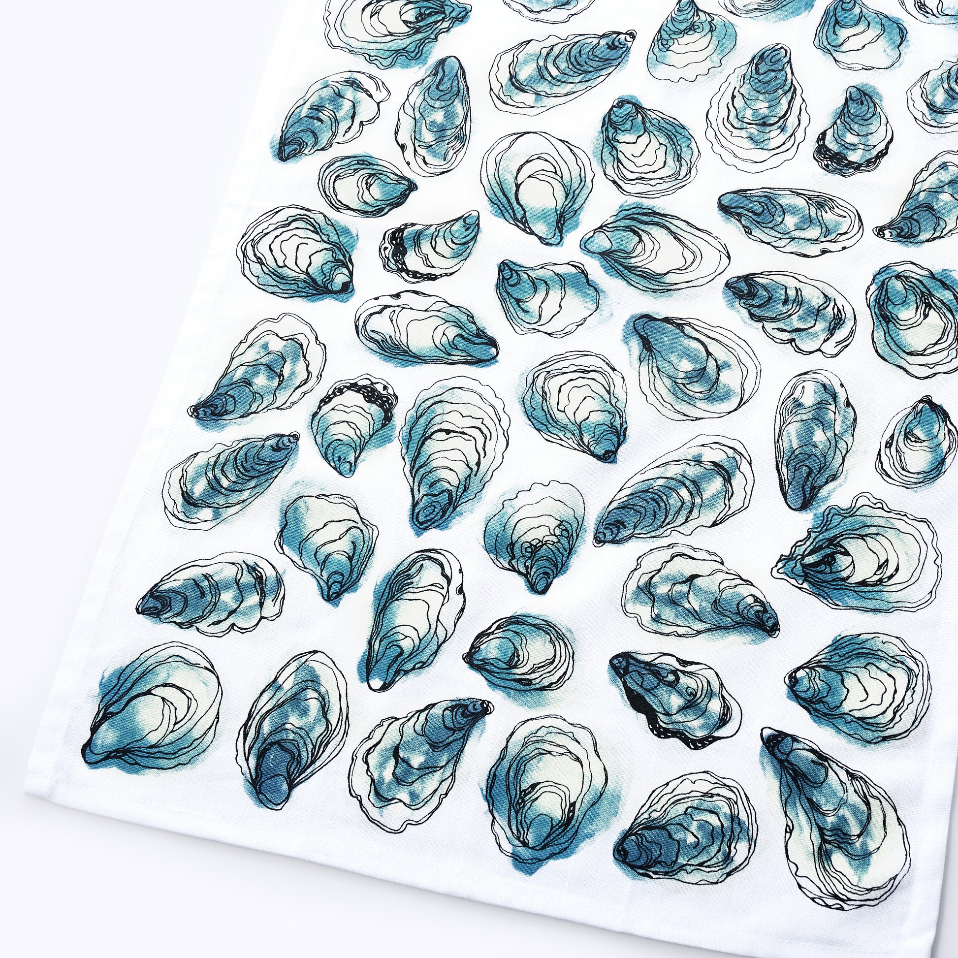 The Oysters Print Tea Towel by true is made from 100 white cotton and showcases a repeated pattern of blue and black oyster shell illustrations—perfect for adding a touch of coastal charm to your kitchen.