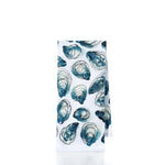 Introducing the Oysters Print Tea Towel by true: crafted from 100 cotton, this white kitchen towel showcases a charming pattern of blue and green oyster shells on a crisp background. Perfect for adding coastal flair to any kitchen.
