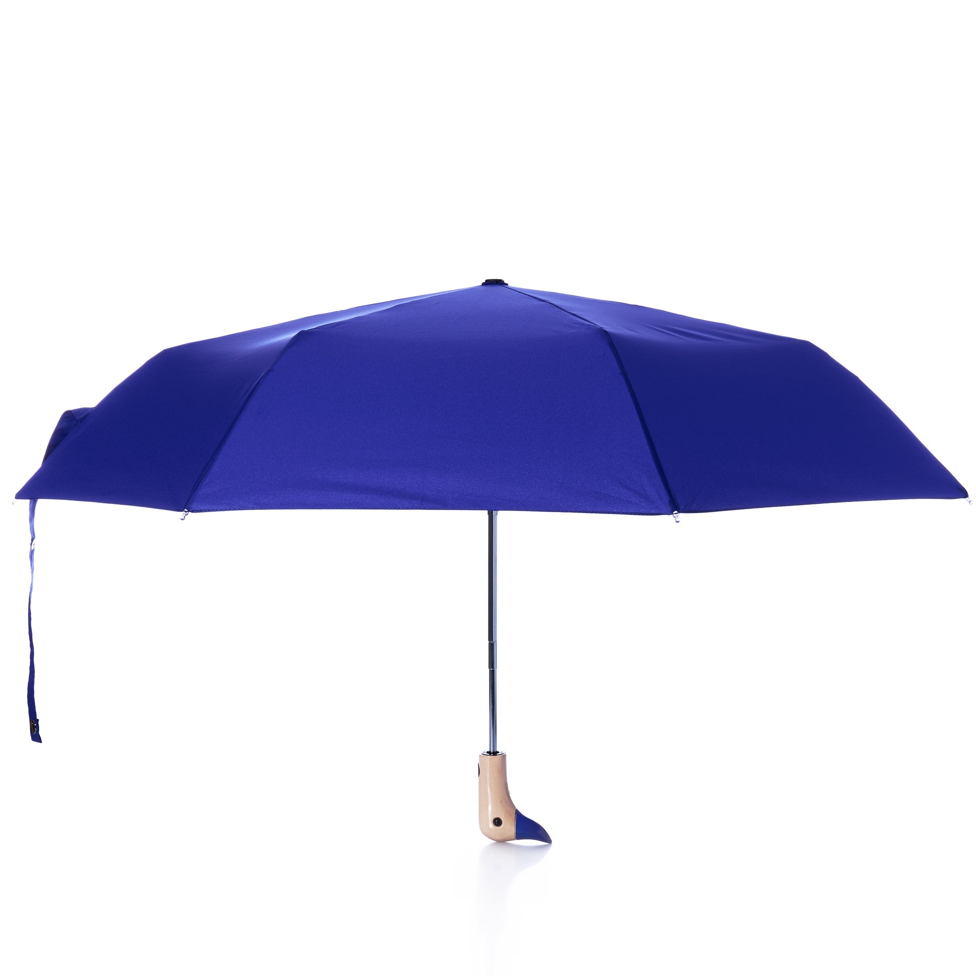A fully opened Original Duck Head Umbrella - Cobalt Blue by ODH Limited t/a Original Duckhead stands upright on a white background, featuring a classic wooden handle and a matching blue strap. This wind resistant umbrella blends timeless style with modern functionality.