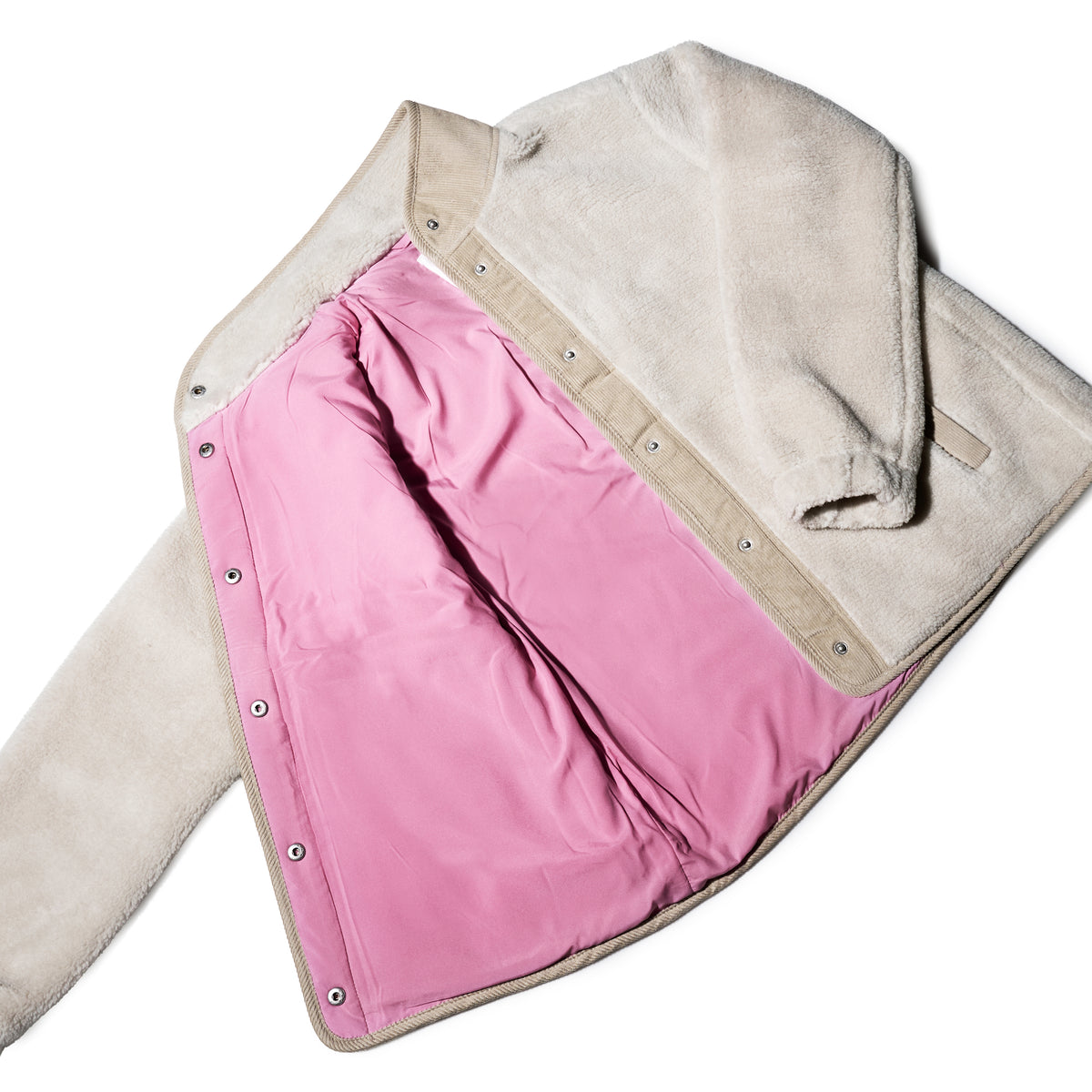 The Fleece Button-Front Coat - Moonstruck by Batela USA Inc is a beige fleece with a pink inner lining and snap buttons, perfect for coastal adventures.