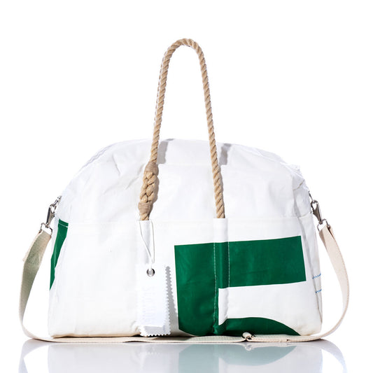 The Vintage Green 5 Weekender by Sea Bags is a white duffel bag with bold green lettering, featuring sturdy hemp handles, a fabric shoulder strap, and a white tag—making it the perfect stylish weekender bag—shown against a clean white background. by Sea Bags