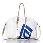 The Sea Bags Vintage Ideal 18 Weekender features a white design with tan hemp handles, a blue geometric print, a detachable shoulder strap, and a white tag, displayed on a white background—perfect as your next getaway bag. by Sea Bags