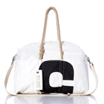 Introducing the Sea Bags Vintage Black 5 Weekender: a white duffel bag featuring sturdy rope handles, a striking vintage black number 5 design, a beige shoulder strap, and an authentic Sea Bags tag—ideal for your next getaway. by Sea Bags