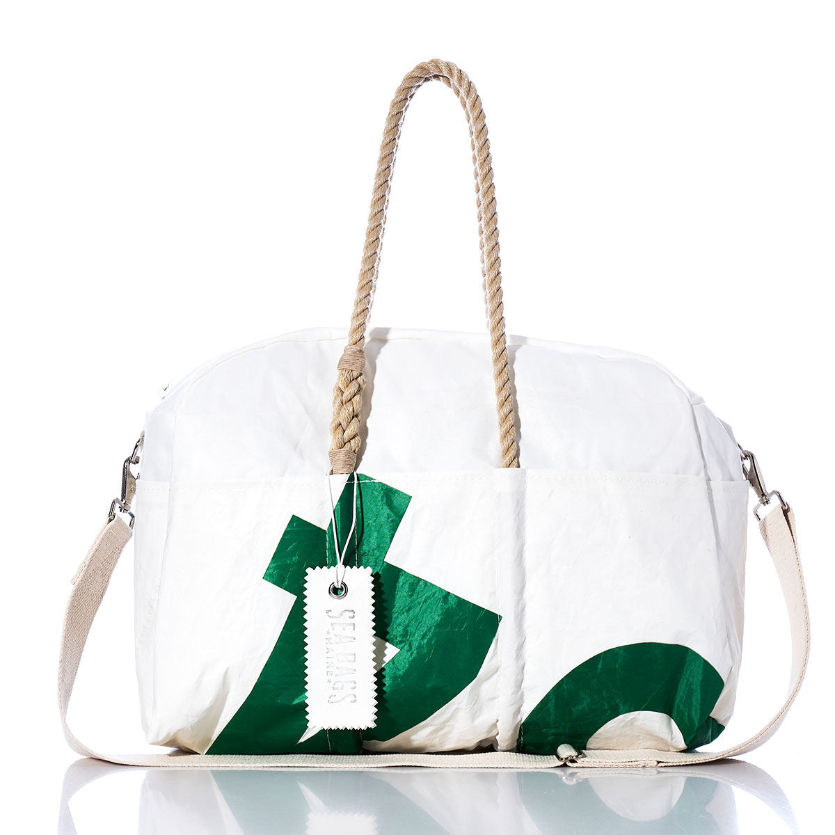 The Sea Bags Vintage Green 64 Weekender—a white and green weekender bag—features sturdy hemp handles, a detachable shoulder strap, and a tag attached to one handle, photographed on a white background. by Sea Bags