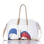 Meet the Vintage BP Weekender by Sea Bags: a white duffle bag featuring rope handles, an adjustable beige shoulder strap, and bold blue and red graphic shapes on the front. Designed for spontaneous escapes, this weekender channels a subtle vintage vibe. A white “SEA BAGS” tag is attached to the handle. by Sea Bags