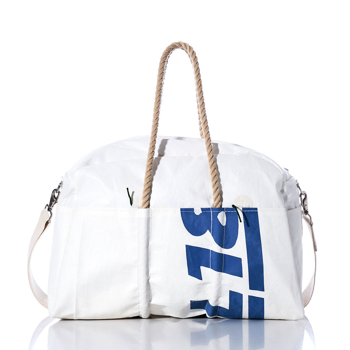 The Sea Bags Vintage Ideal18 Weekender is a white bag with rope handles, blue numbers printed on the side, and metal clasps on the ends. It features a removable shoulder strap and is displayed on a white background. by Sea Bags