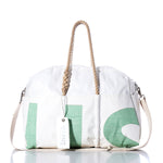 White and green duffel bag featuring rope handles, a removable shoulder strap, and a white tag labeled Sea Bags against a white background—the Vintage US Weekender by Sea Bags is the ultimate getaway bag for your next adventure. by Sea Bags