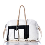The Sea Bags Vintage Etchells 22 Weekender is a white and black duffel getaway bag featuring sturdy hemp handles, a beige shoulder strap, and a white tag reading SEABAGS, photographed on a white background. by Sea Bags