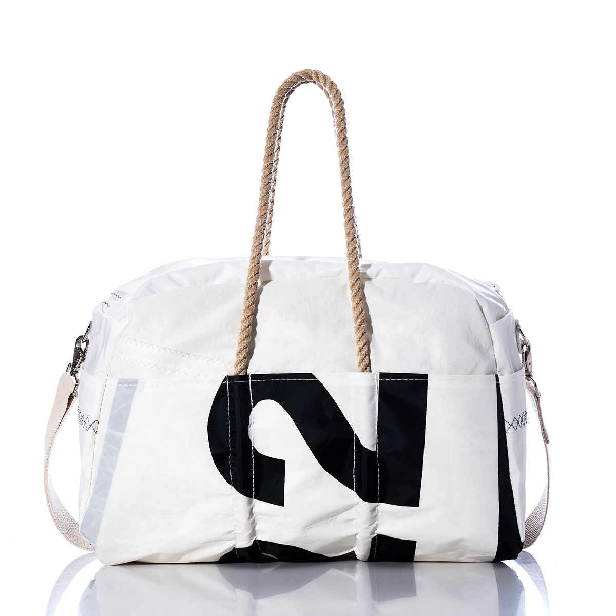The Sea Bags Vintage Etchells 22 Weekender is a white duffle bag featuring tan hemp handles and a striking black number graphic on the front. Inspired by classic sailing style, this getaway bag is shown against a white background. by Sea Bags