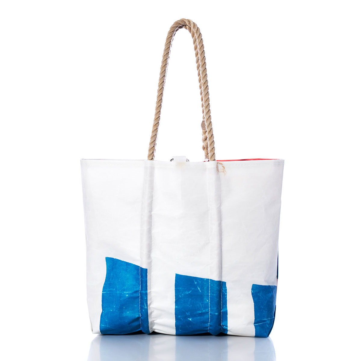 The Sea Bags Vintage Etchells Medium Tote is a handmade white sailcloth tote bag crafted from recycled sails, featuring blue geometric accents and sturdy rope handles. Set against a plain white background, this durable Maine-made bag embodies timeless nautical style. by Sea Bags