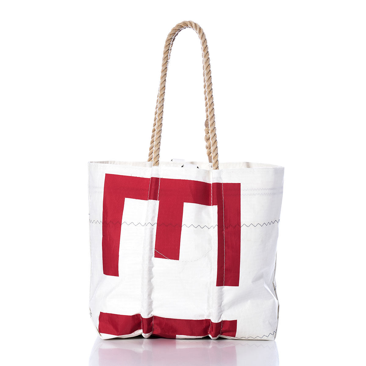 Sea Bags Vintage 843 Medium Tote—featuring a bold red geometric design on white canvas and sturdy, hand-spliced rope handles—is showcased against a white background, offering an authentic homage to Maine-crafted bags and classic vintage sail tote style. by Sea Bags